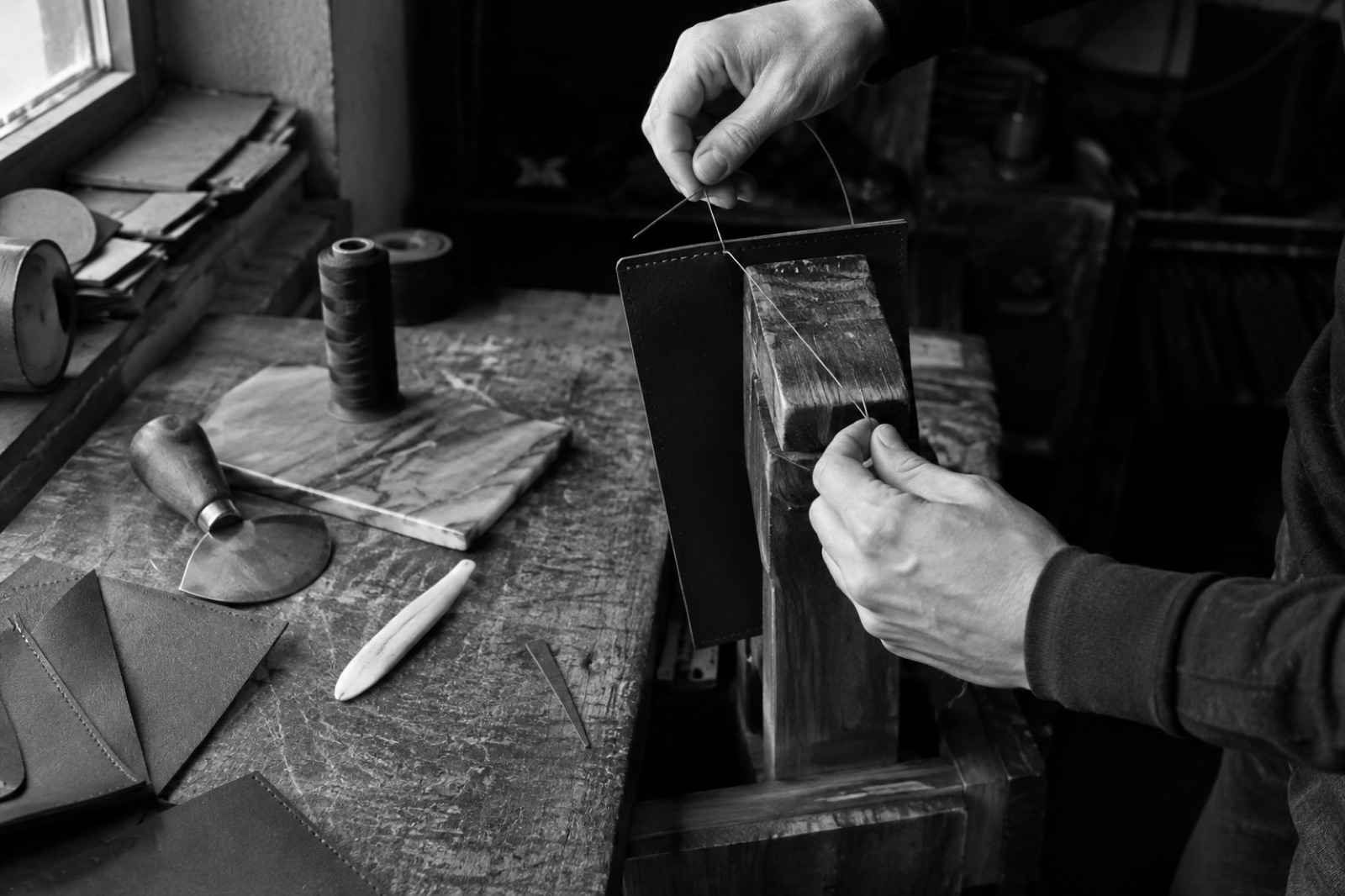 A cutter working a hide on the bench